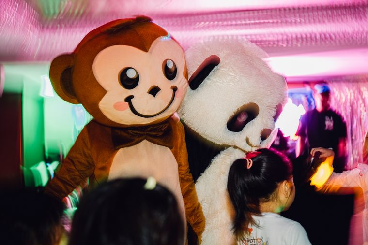The monkey and panda mascots greeting young disco guests